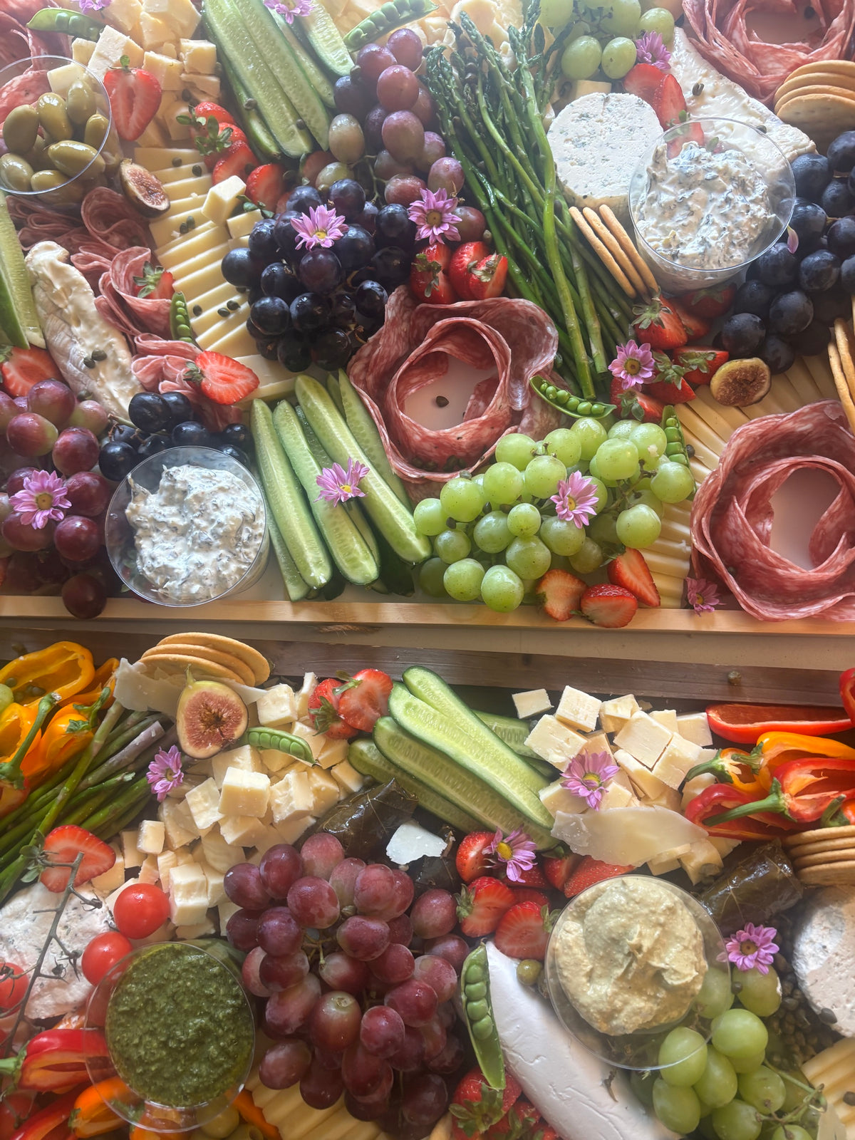 Two Capitol Hill Classic Ultimate Grazing Boards with cheeses, salami roses, asparagus, grapes, figs and edible flowers